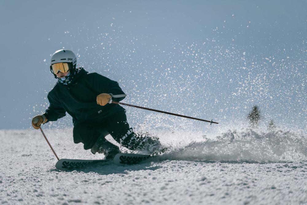 skier carving in spring snow